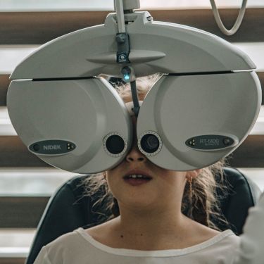 woman getting phoropter