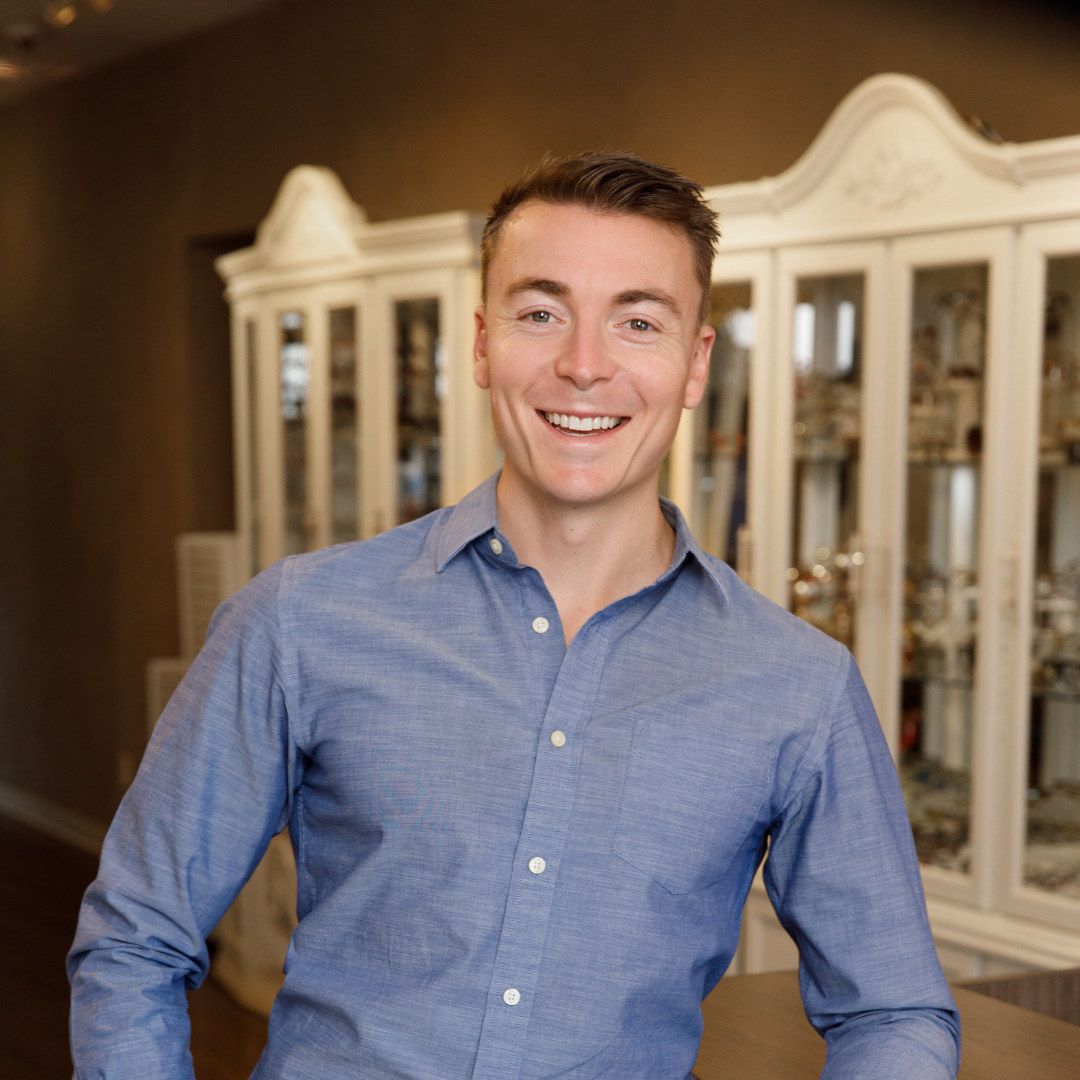 Dr. Danny, optometrist at Inspired Eyes, smiling inside the eyewear boutique