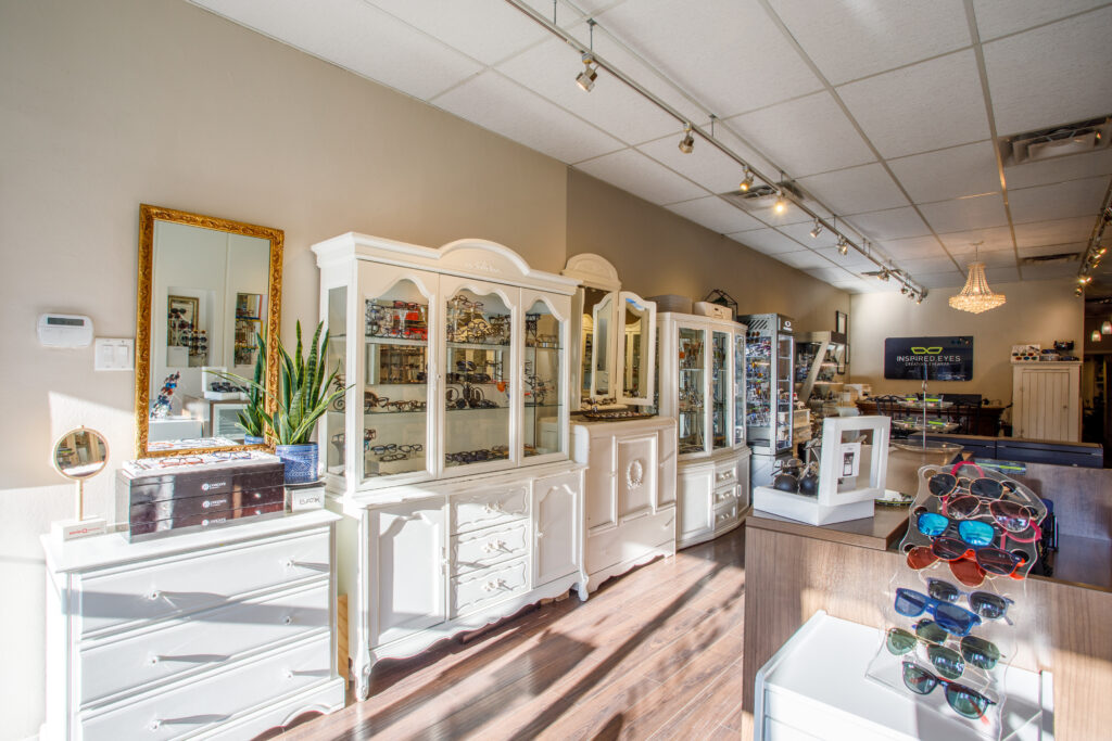Interior of Inspired Eyes eyewear boutique with display cabinets and eyewear collection