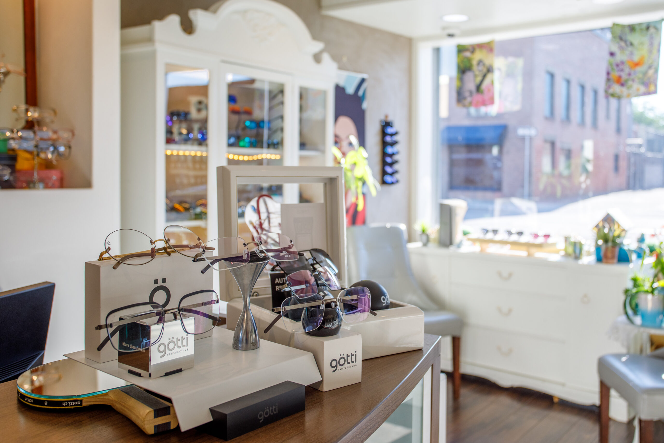 Götti eyewear collection displayed inside a sunlit optical boutique