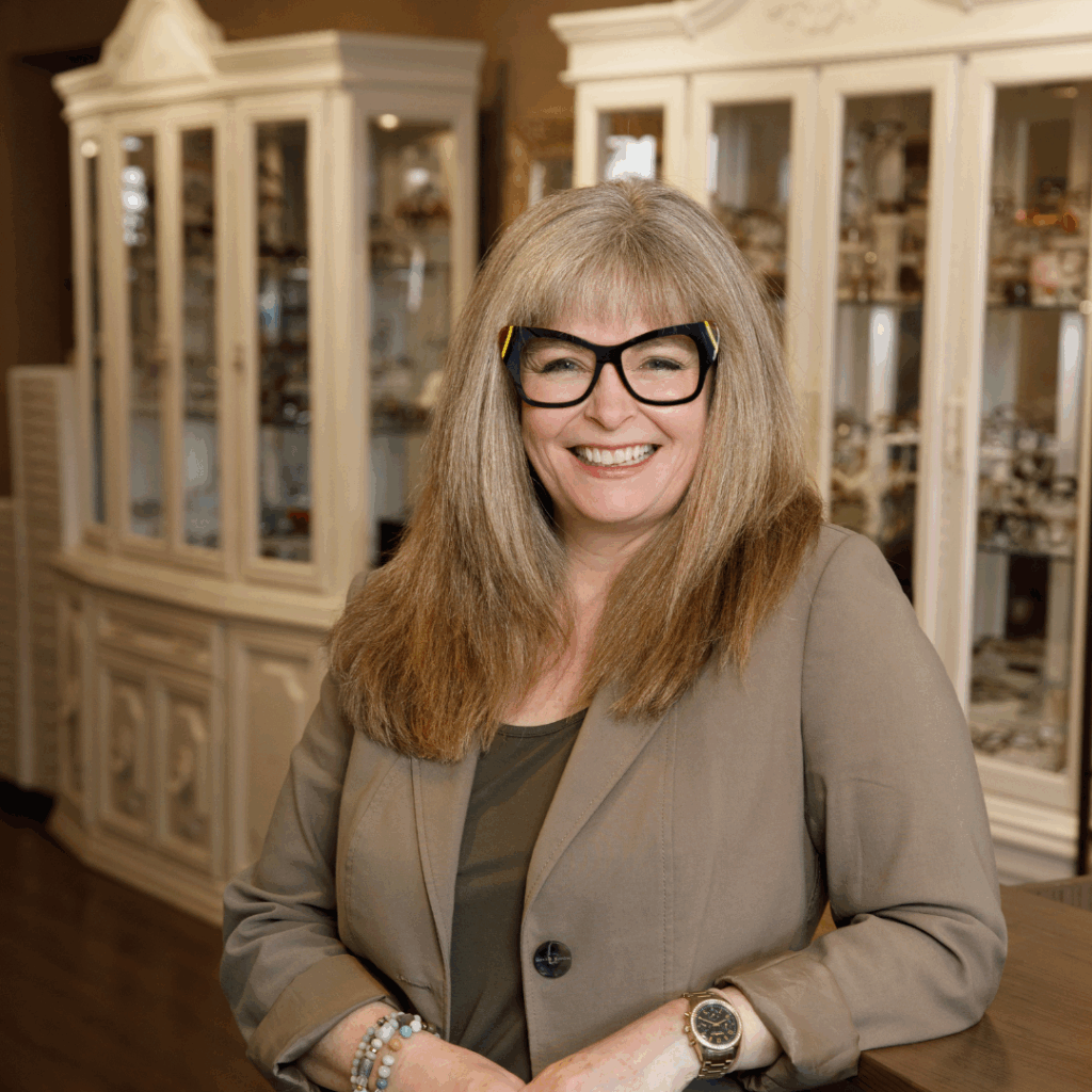 Lana, founder of Inspired Eyes, smiling confidently in the boutique