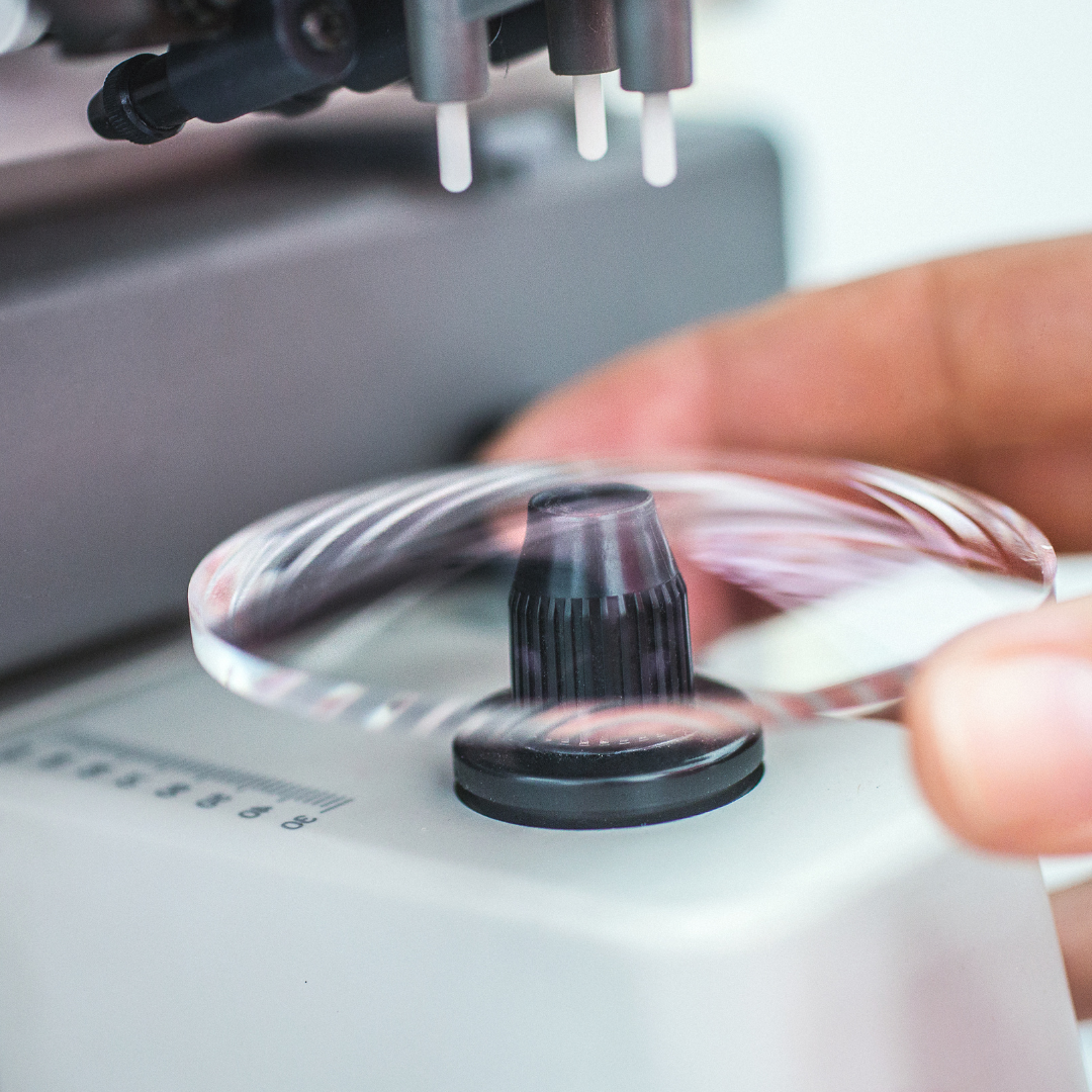 Close-up of an optical lens being tested by a lensometer
