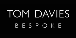 Tom Davies Bespoke eyewear logo on black background